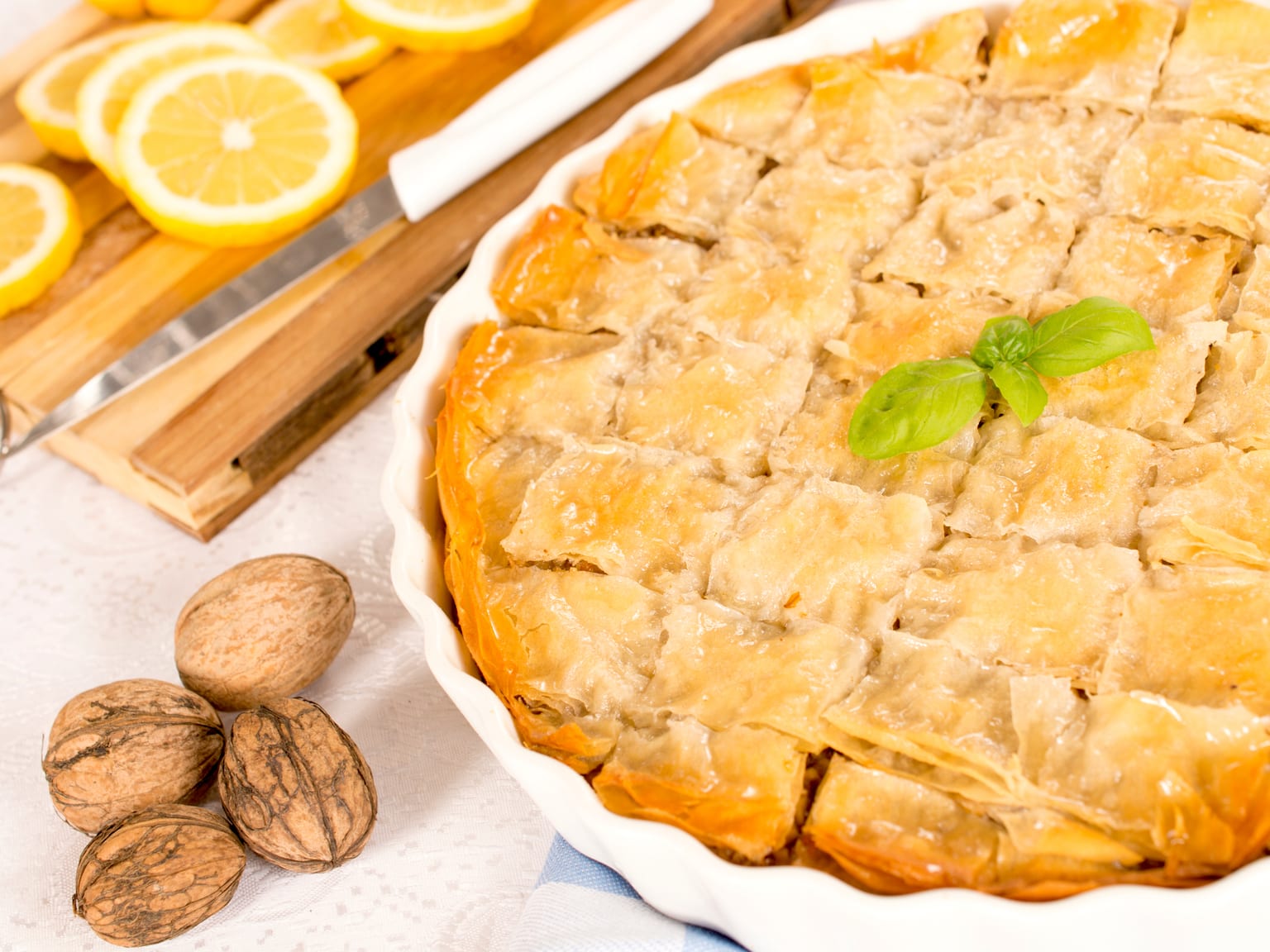 Cypriot baklava with almonds, walnuts, and citrus served as a natural-light editorial food photograph