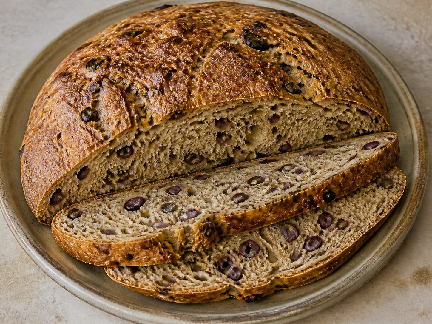 Greek olive and oregano bread (eliopsomo) served as a natural-light editorial food photograph