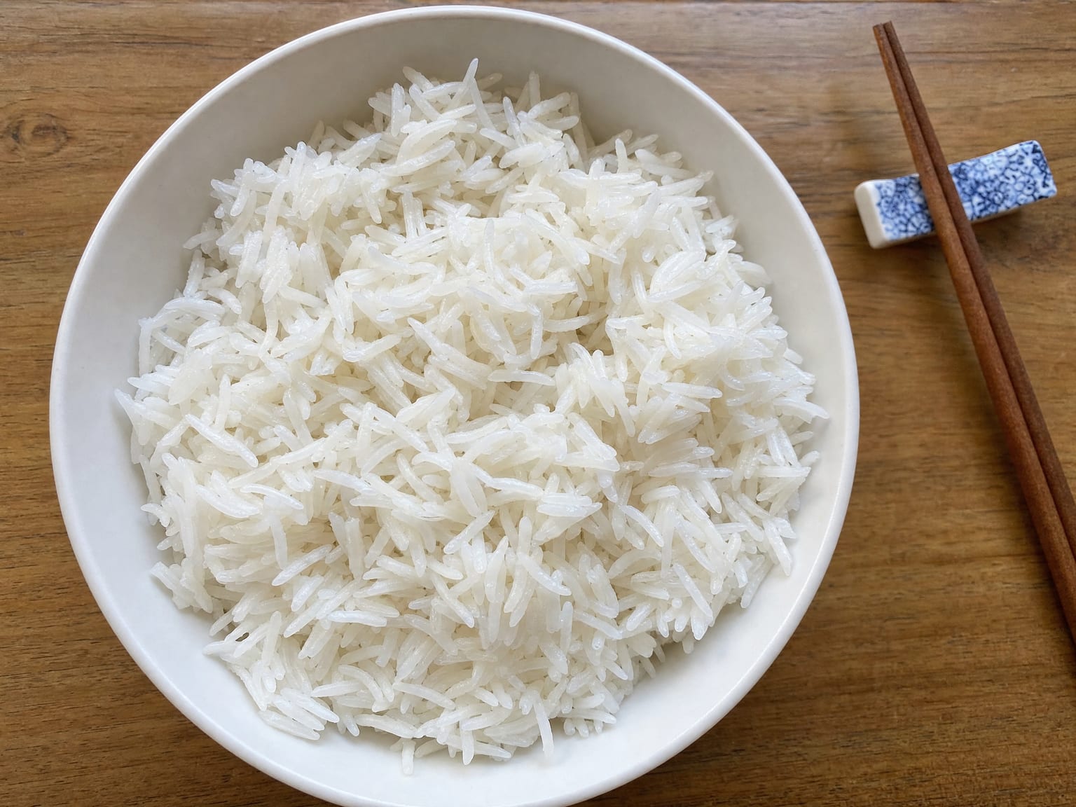A bowl of fluffy white long grain rice with separate glistening grains